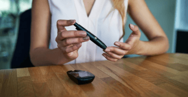 Woman checking blood sugar