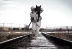 soldier carrying a dog